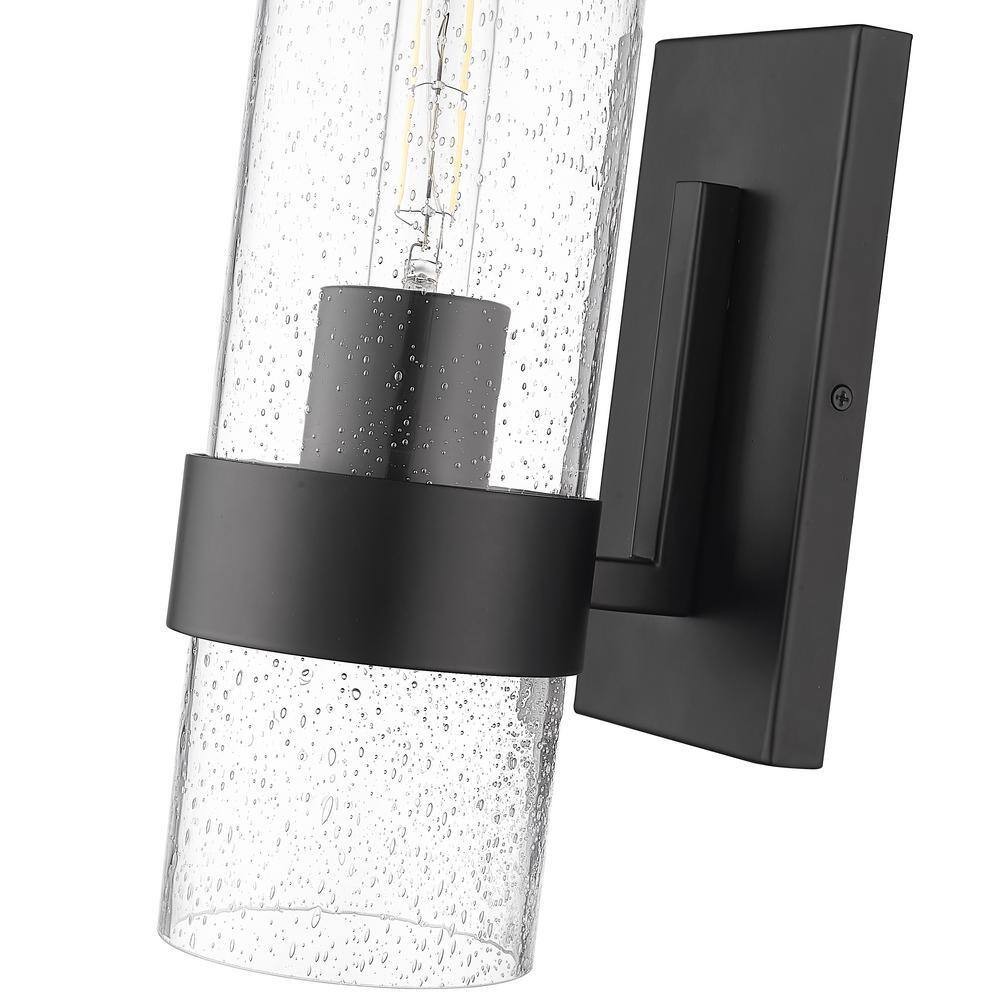 Millennium Lighting 4.75 in. 1-Light Matte Black Sconce Clear Seeded Glass