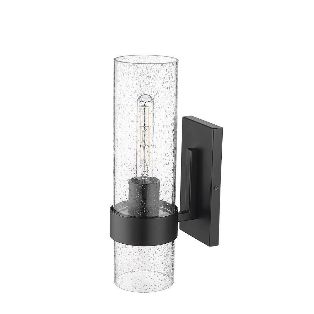Millennium Lighting 4.75 in. 1-Light Matte Black Sconce Clear Seeded Glass