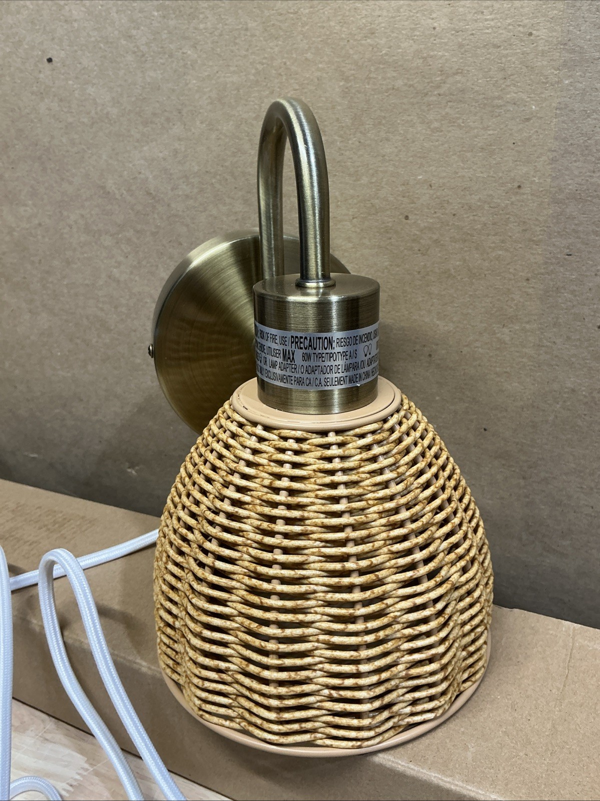 Isla 1-Light Matte Brass Plug-In or Hardwire Wall Sconce with Faux Rattan Shade