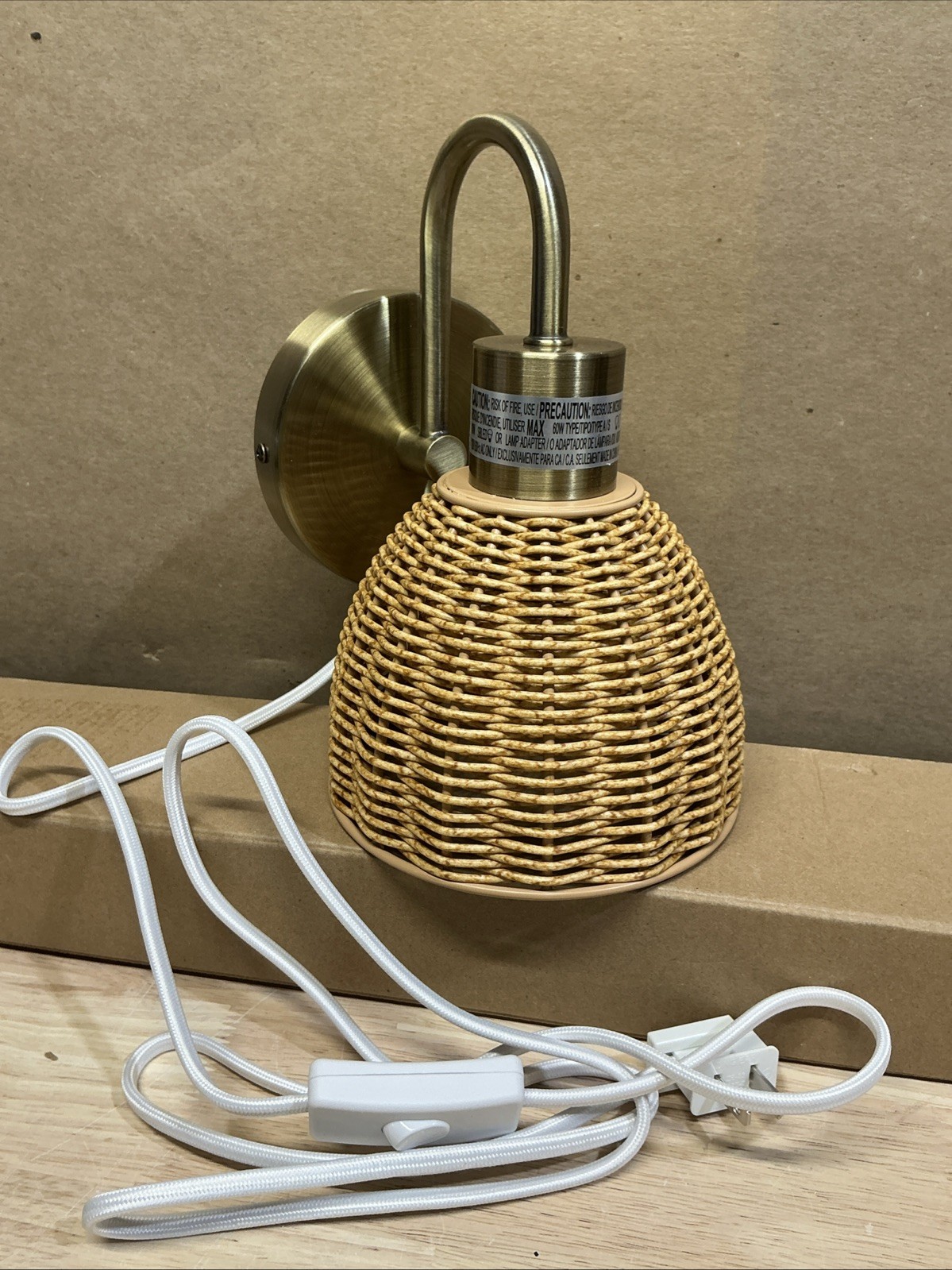 Isla 1-Light Matte Brass Plug-In or Hardwire Wall Sconce with Faux Rattan Shade