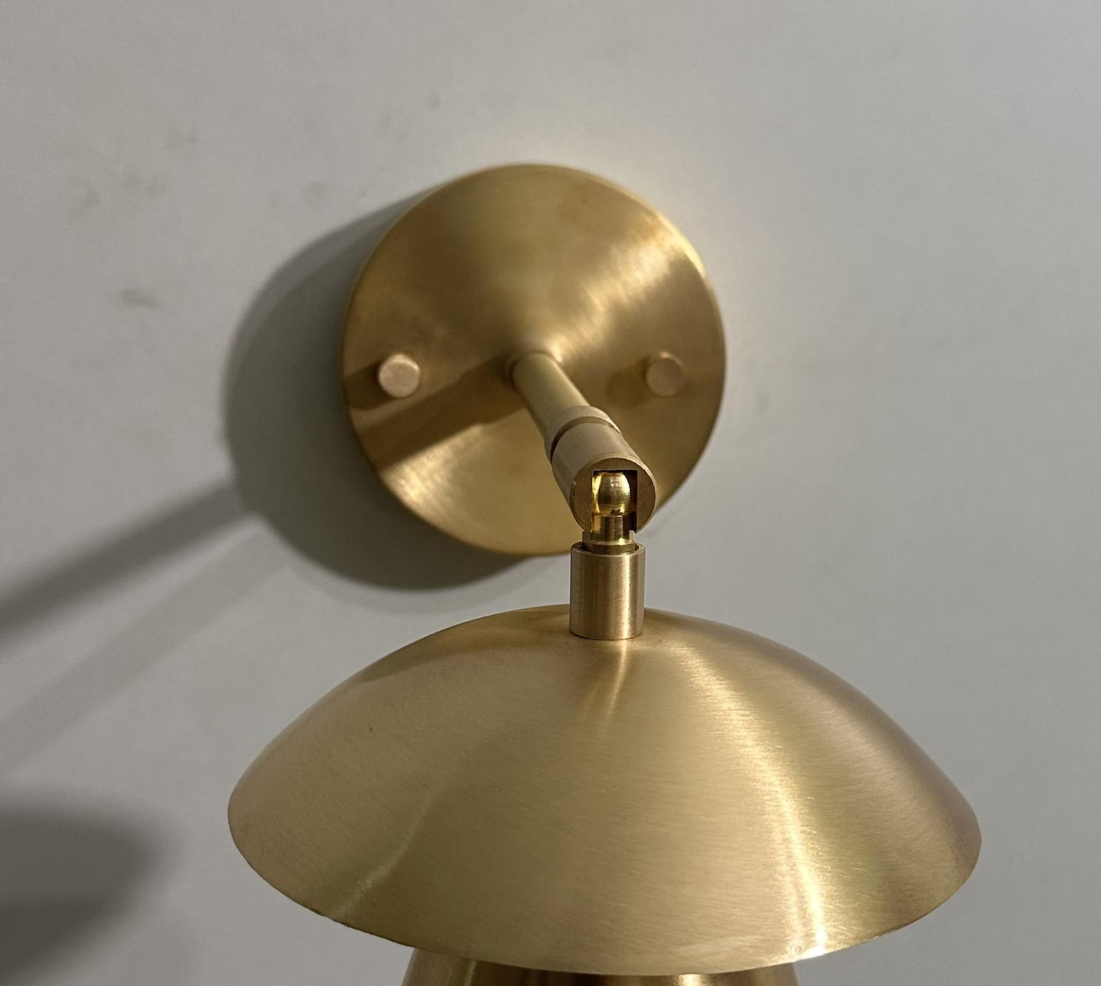 Mid-Century Modern Italian Wall Sconce: Adjustable Raw Brass Cone Shade Lamp